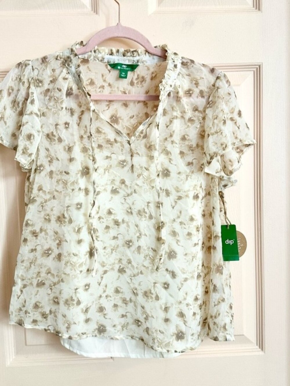 NWT cream floral dip top